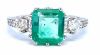 "Retailer Liquidation Brand New" Emerald and Diamond Ring set in 18K white gold