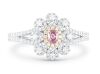 18k White gold ring set with a centre oval cut 0.108ct natural FDPP (Natural Fancy Deep Pinkish Purple) diamond